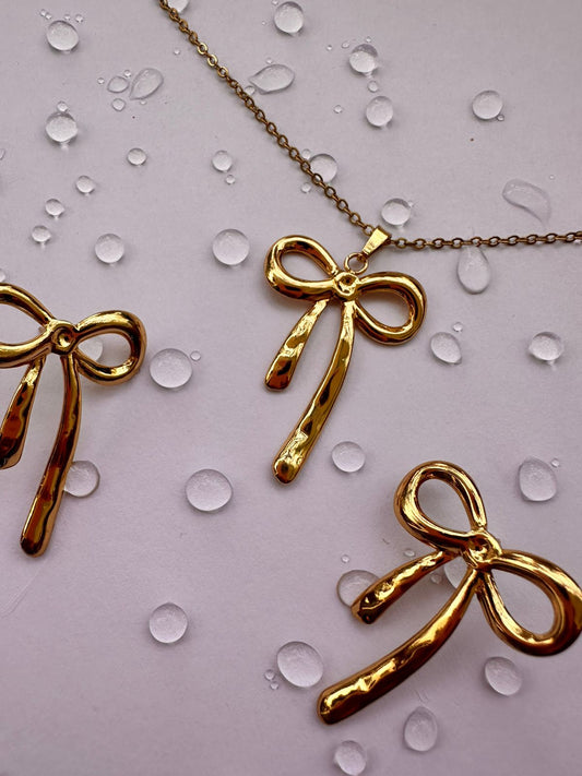 Anouka Long Bow Charm Pendant & Earrings Set